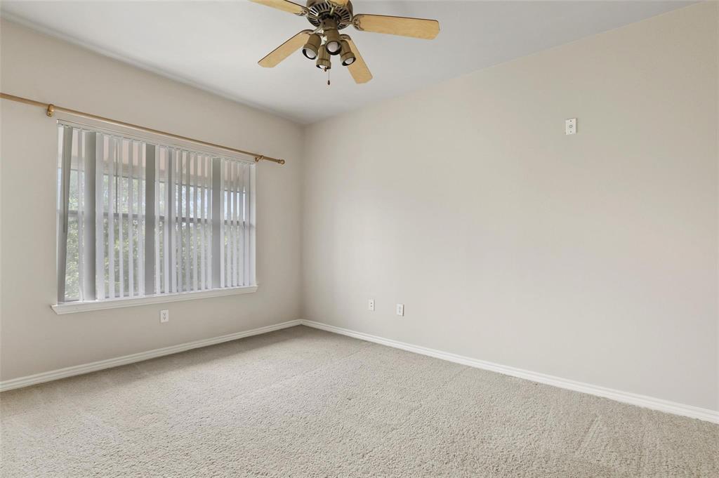 3102 Kings Road, Unit 1303 Dallas, TX 75219 - Photo 7 of 25 an empty room with a window