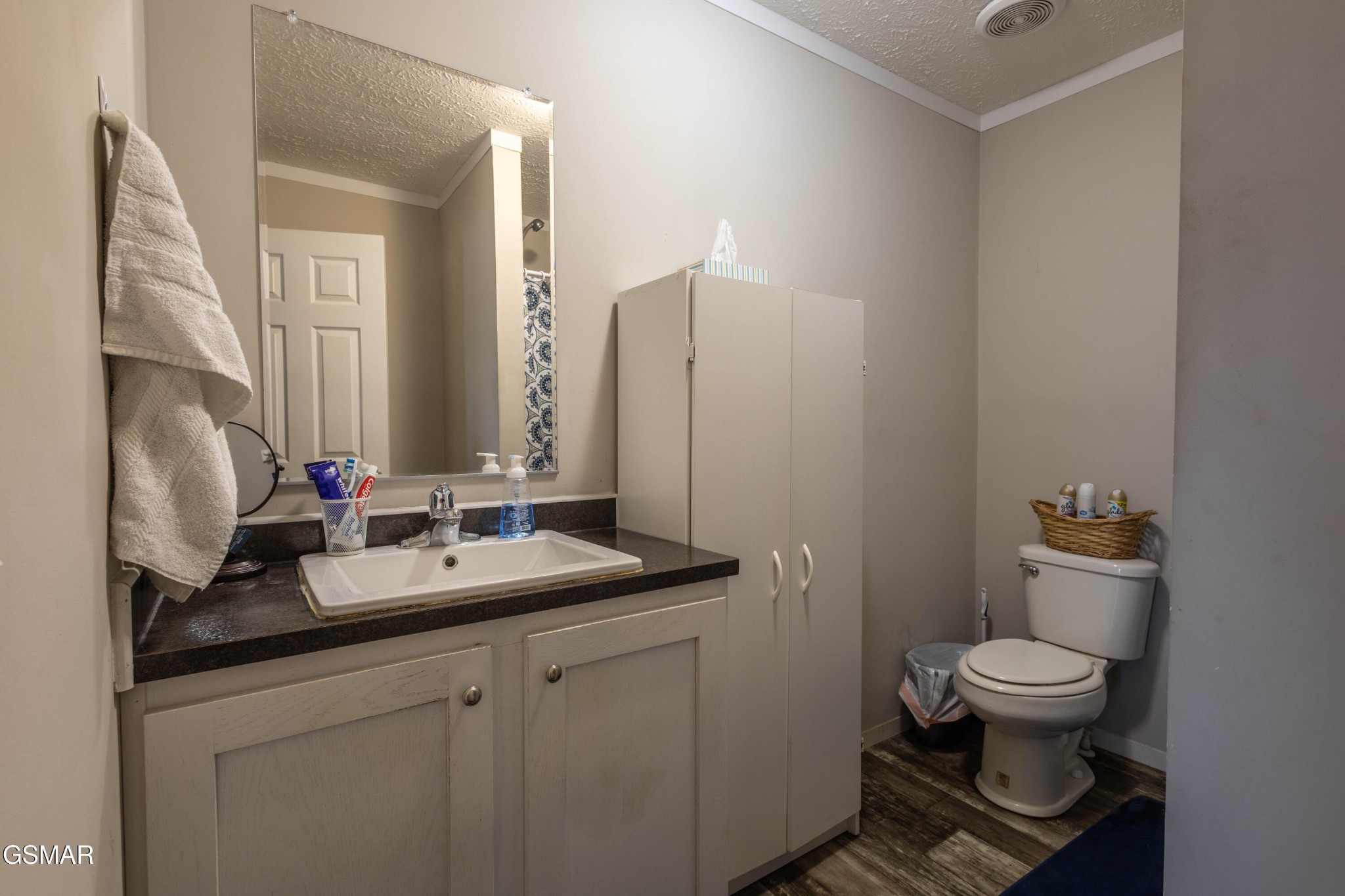 1165 Ballplay Road Madisonville, TN 37354 - Photo 18 of 34 a bathroom with a granite countertop toilet sink and mirror