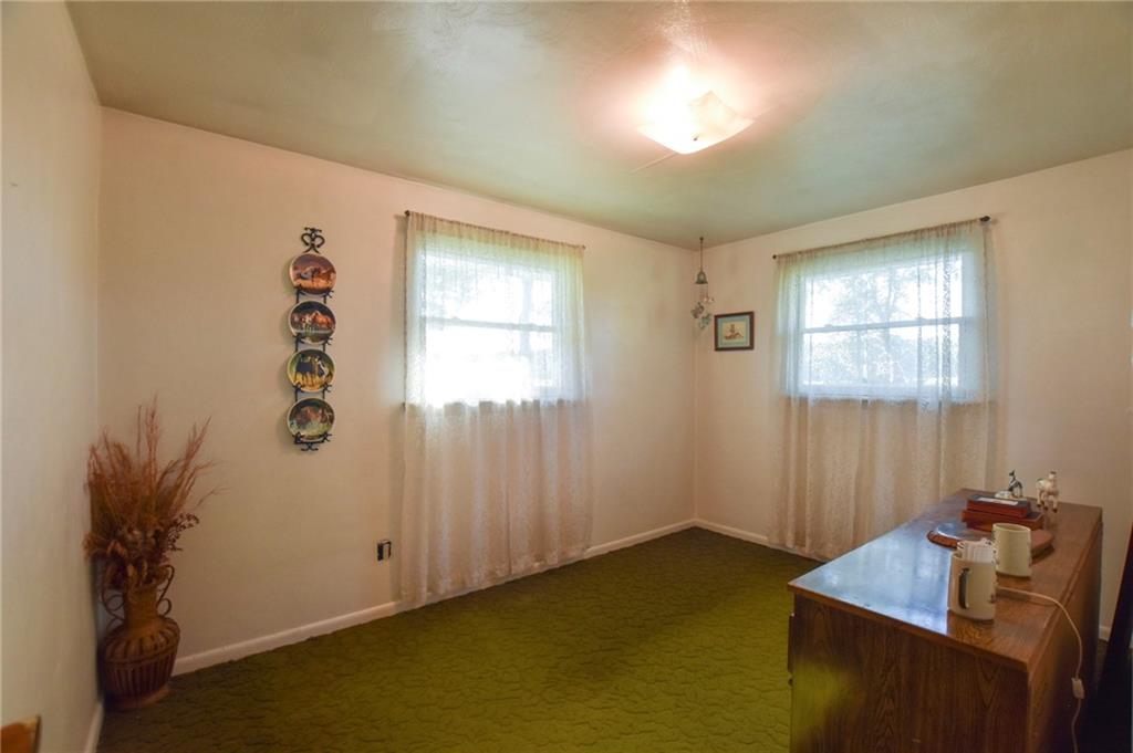 428 Dinnerbell Road Butler, PA 16002 - Photo 7 of 14 a room with a window and a potted plant