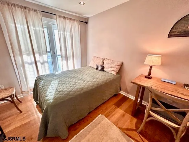 a bedroom with a bed and a lamp