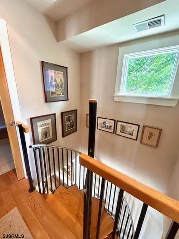 a view of a hallway with windows