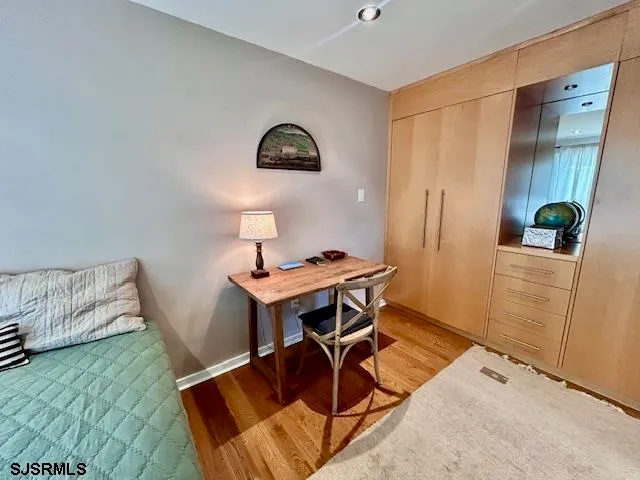 a workspace with furniture and wooden floor