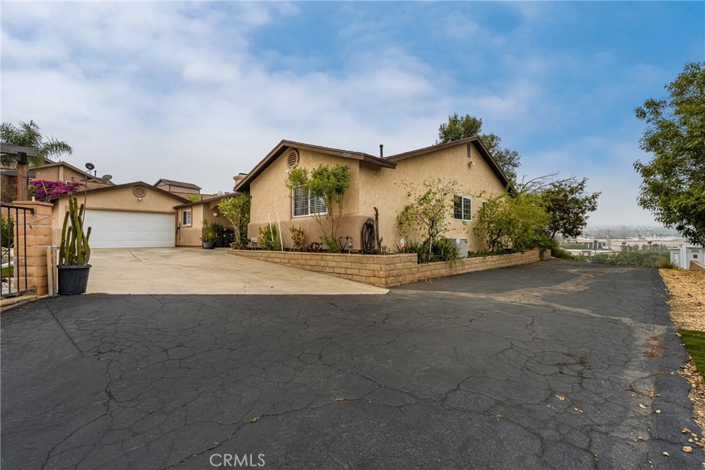 7233 Bel Air Street Corona, CA 92881 - Photo 1 of 39 a view of the house with a street