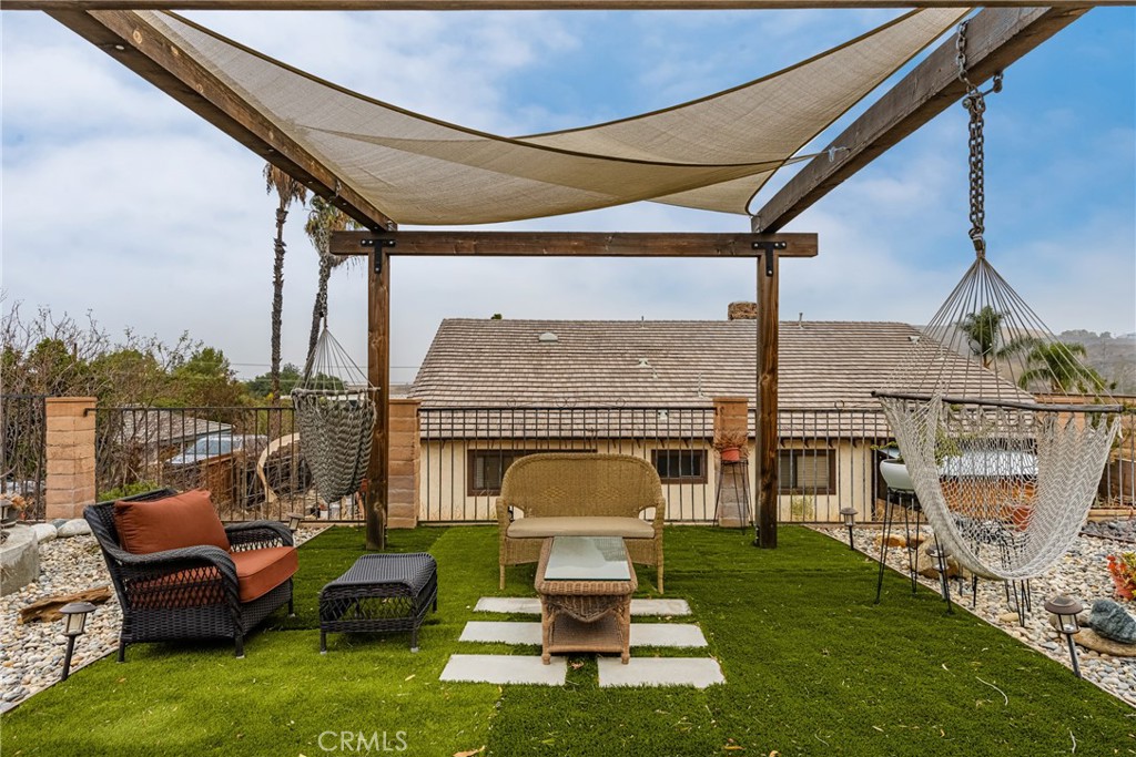 7233 Bel Air Street Corona, CA 92881 - Photo 14 of 39 a view of a patio with couches chairs and roof deck