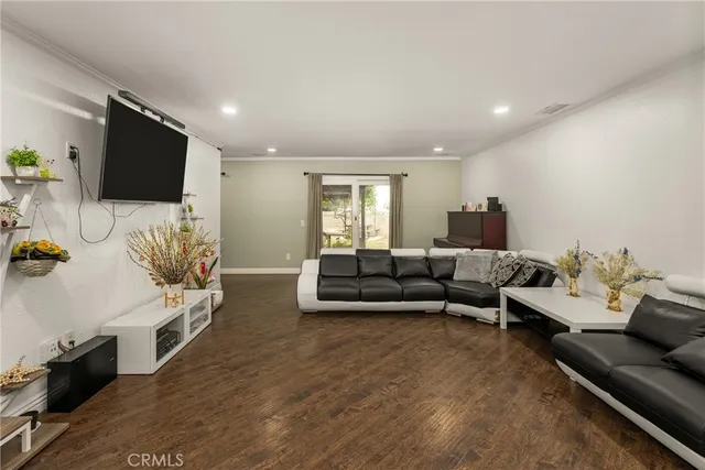 a room with furniture pool table and window