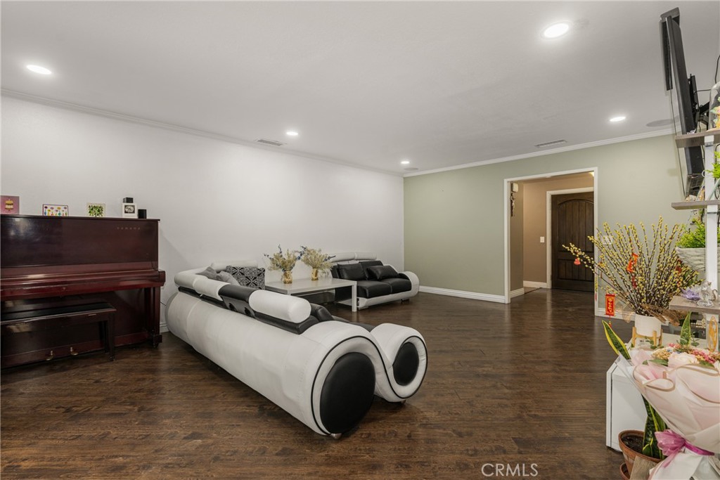 7233 Bel Air Street Corona, CA 92881 - Photo 18 of 39 a living room with furniture and a wooden floor
