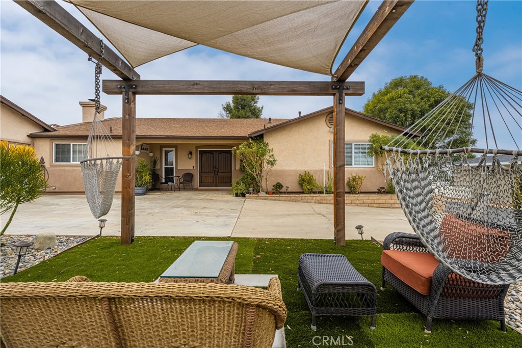 7233 Bel Air Street Corona, CA 92881 - Photo 2 of 39 a front view of a house with garden