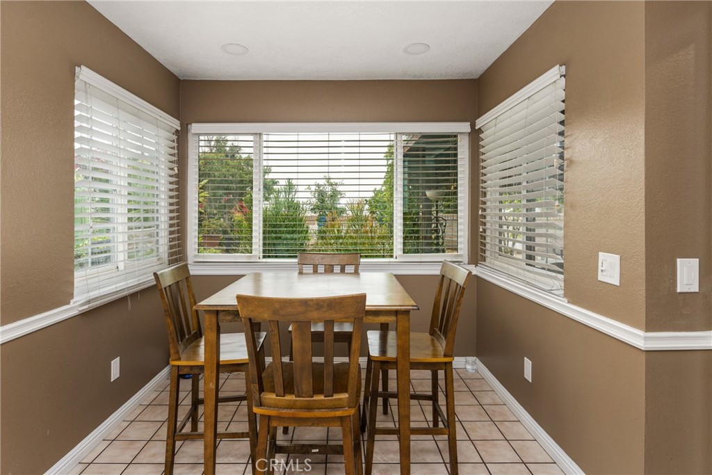 7233 Bel Air Street Corona, CA 92881 - Photo 24 of 39 a view of a dining room with furniture and window