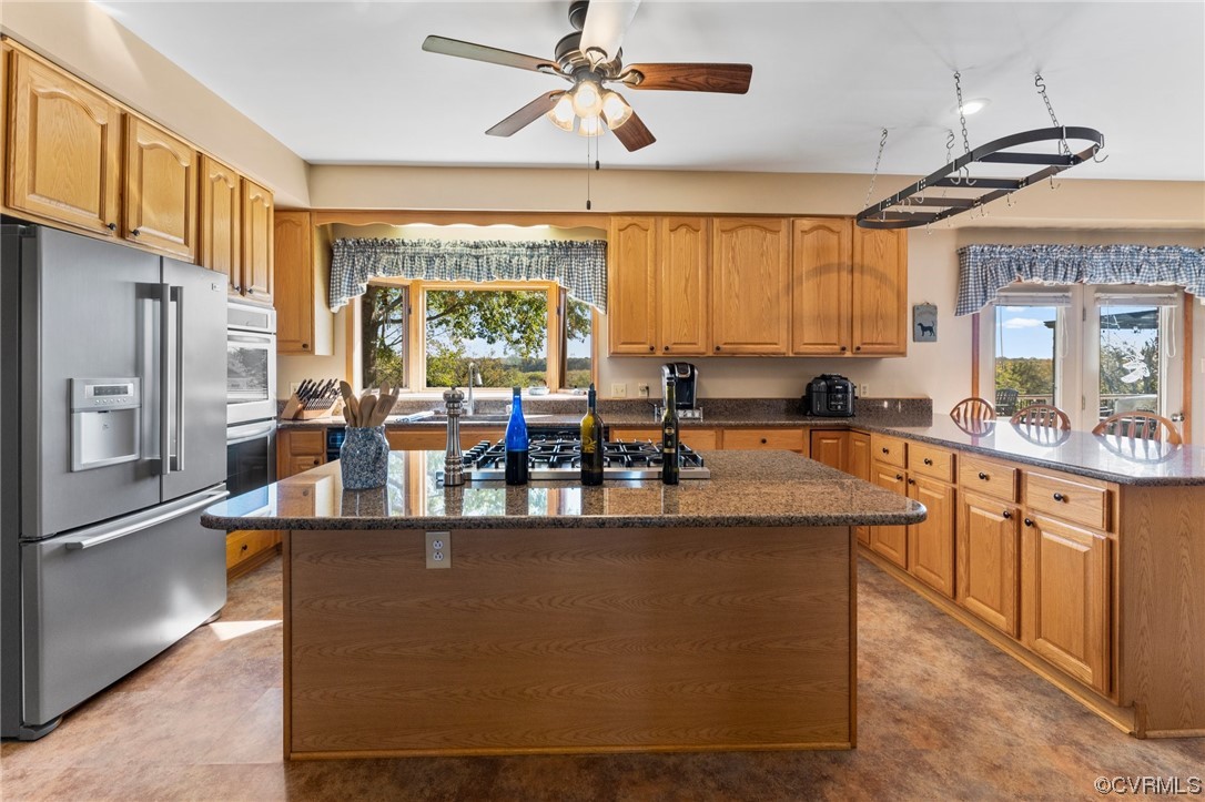 11221 Bristersburg Road Catlett, VA 20119 - Photo 27 of 49 a large kitchen with kitchen island a large counter top space appliances and a large window