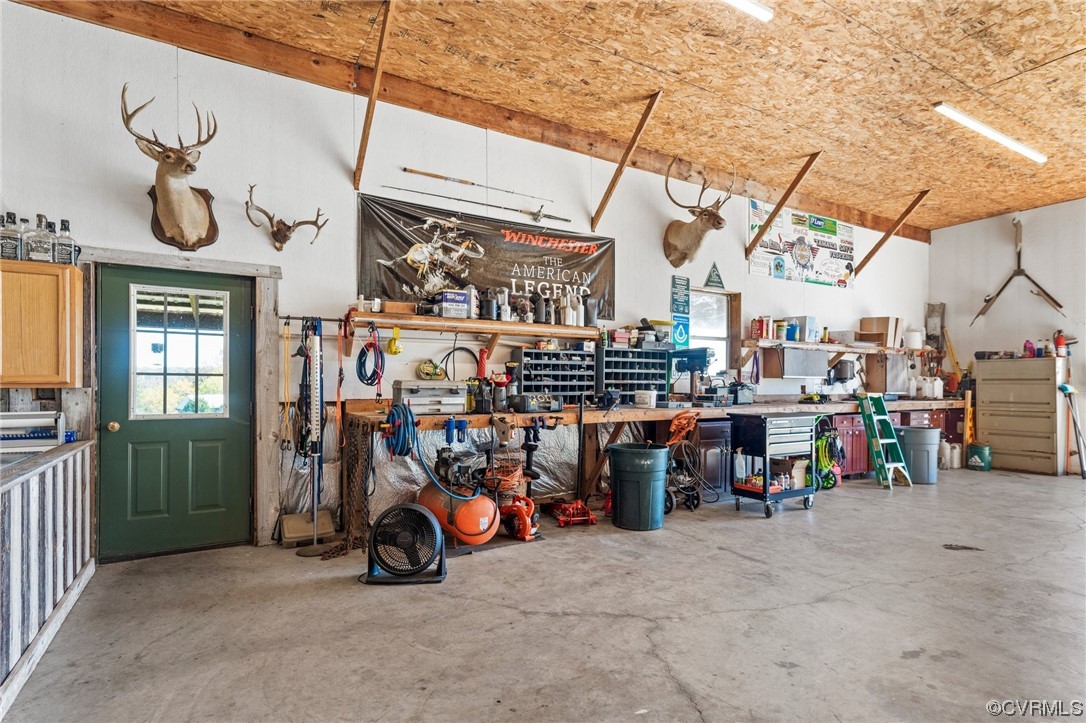 11221 Bristersburg Road Catlett, VA 20119 - Photo 31 of 49 a view of a storage area with a table and chairs