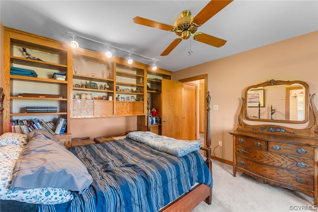 11221 Bristersburg Road Catlett, VA 20119 - Photo 37 of 49 a bedroom with a bed and a chandelier