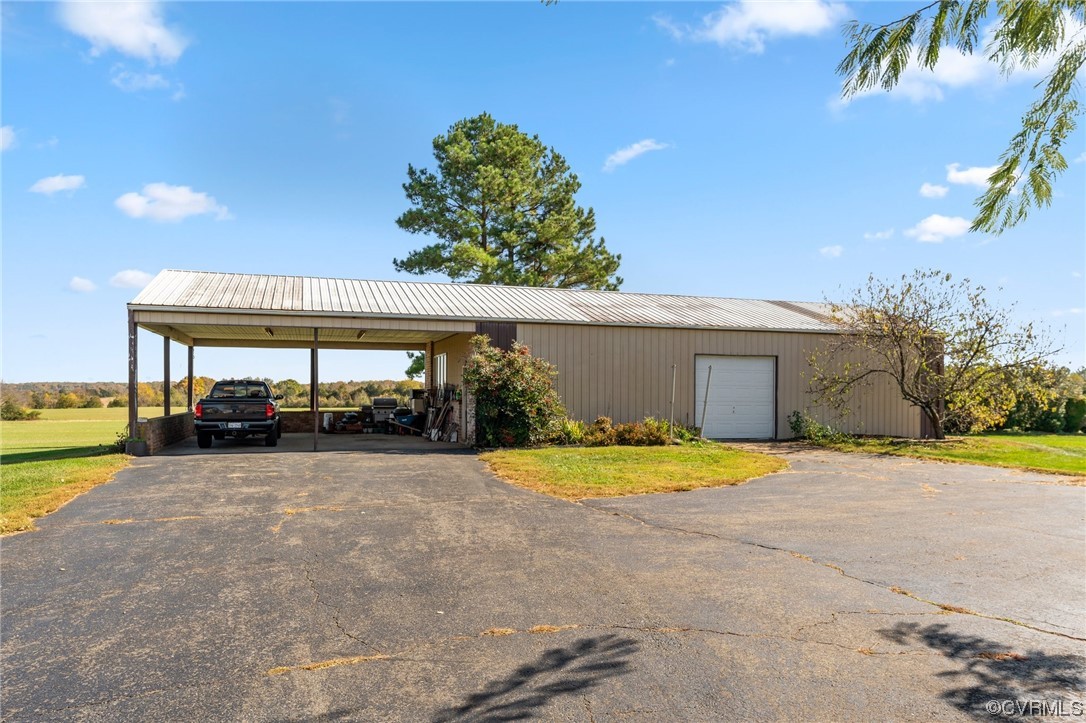 11221 Bristersburg Road Catlett, VA 20119 - Photo 39 of 49 a view of a house with a yard and a garage