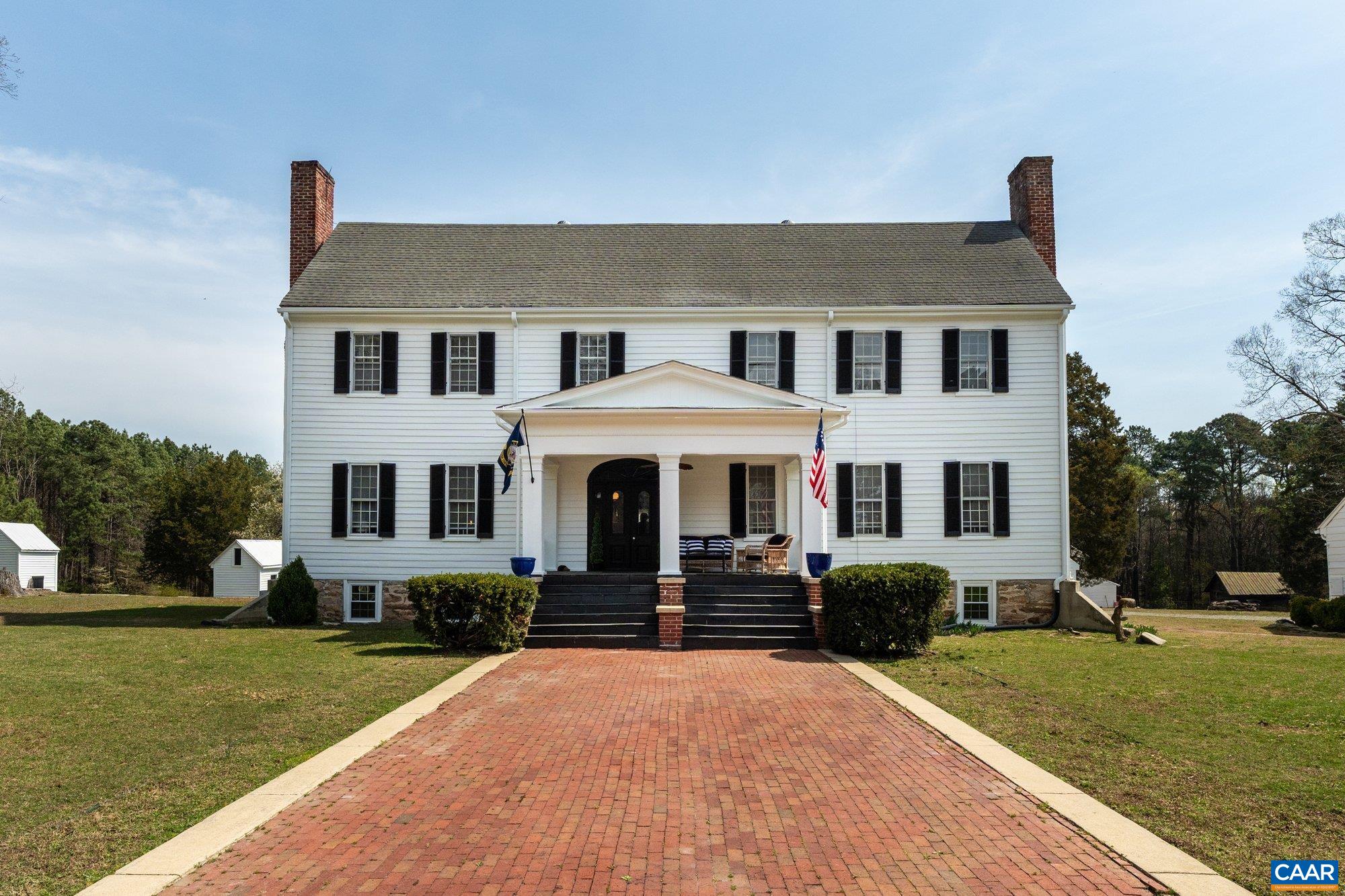 14910 Western Mill Road Lawrenceville, VA 23868 - Photo 12 of 73 a front view of a house with garden