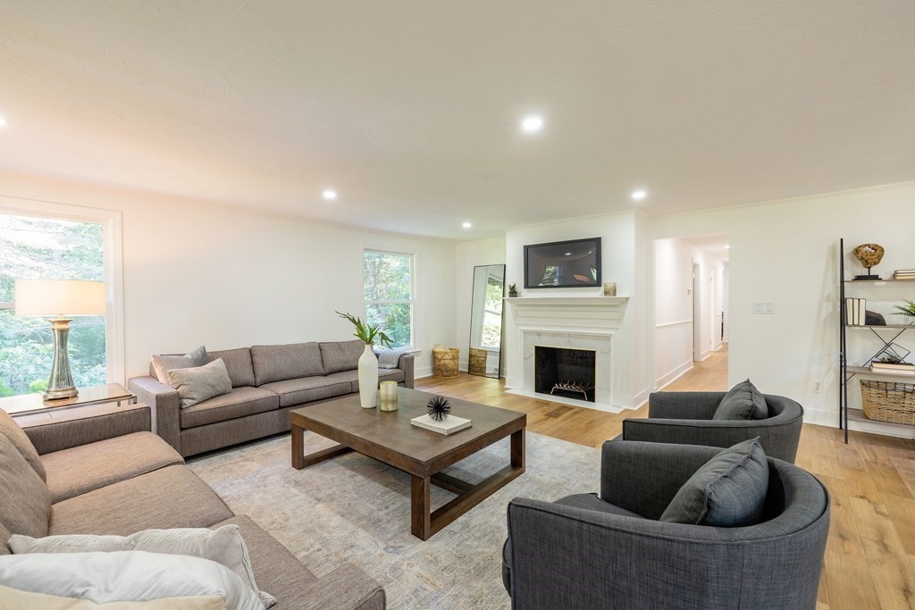 66 Patten Road Westford, MA 01886 - Photo 11 of 42 a living room with furniture a fireplace and a large window