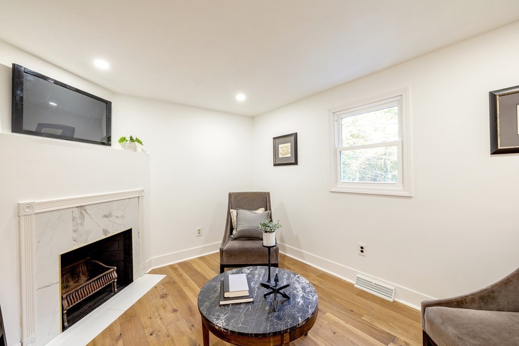 66 Patten Road Westford, MA 01886 - Photo 13 of 42 a living room with furniture and a fireplace