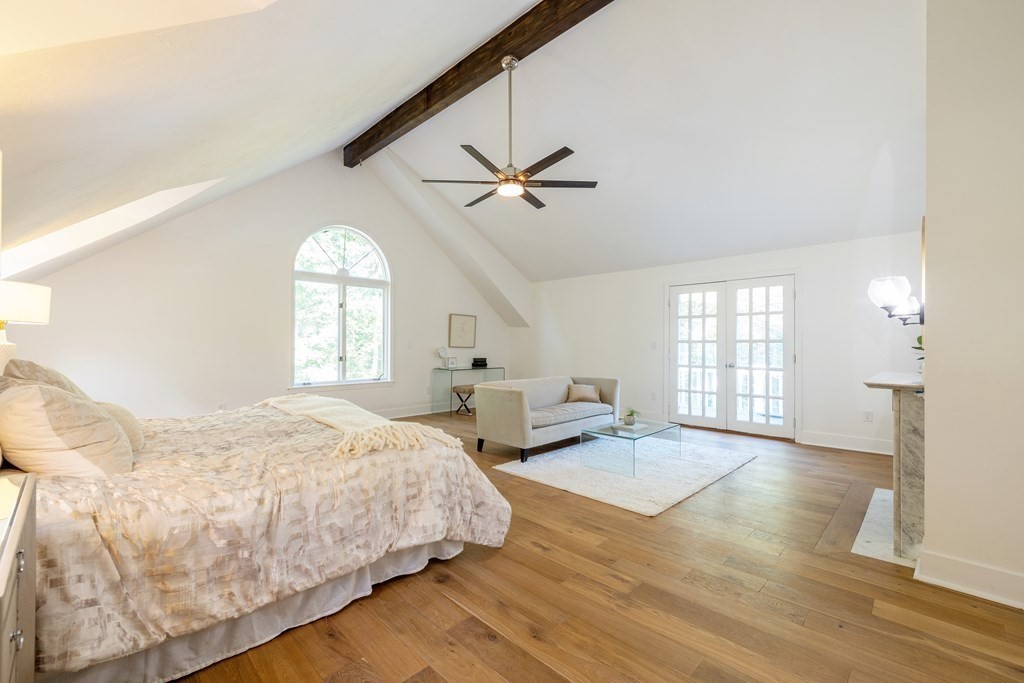 66 Patten Road Westford, MA 01886 - Photo 19 of 42 a spacious bedroom with a bed a window and closet