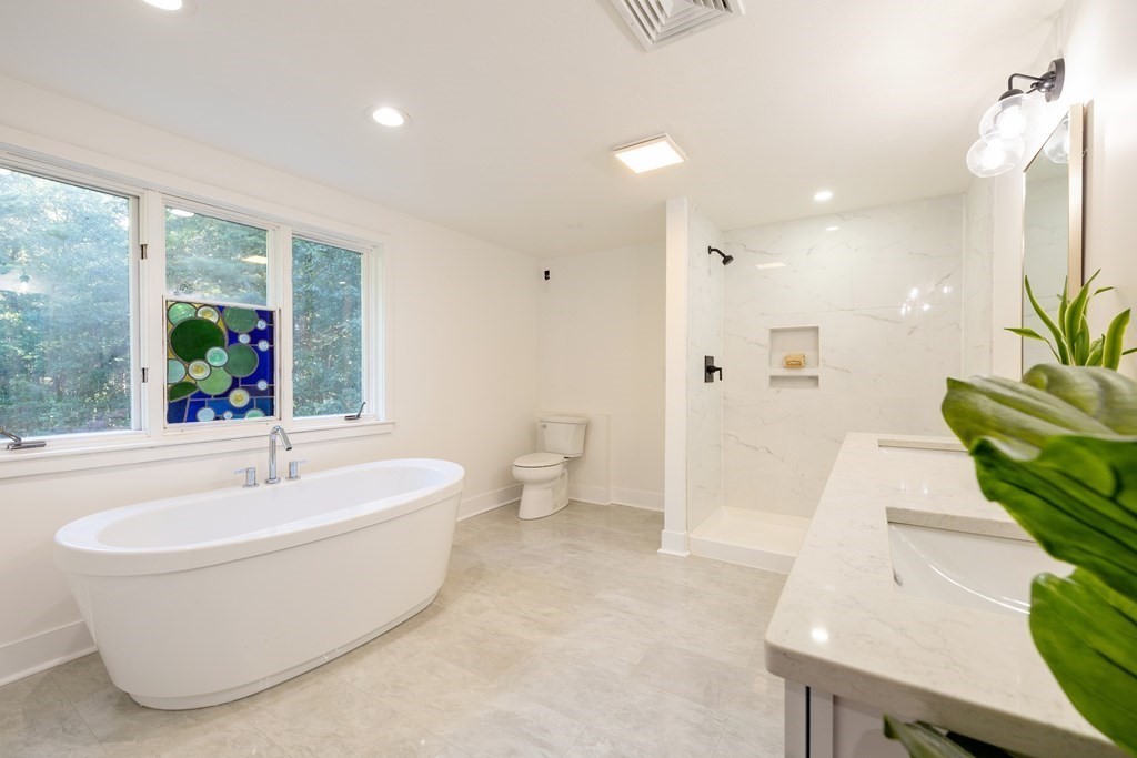 66 Patten Road Westford, MA 01886 - Photo 22 of 42 a spacious bathroom with a bathtub and sink