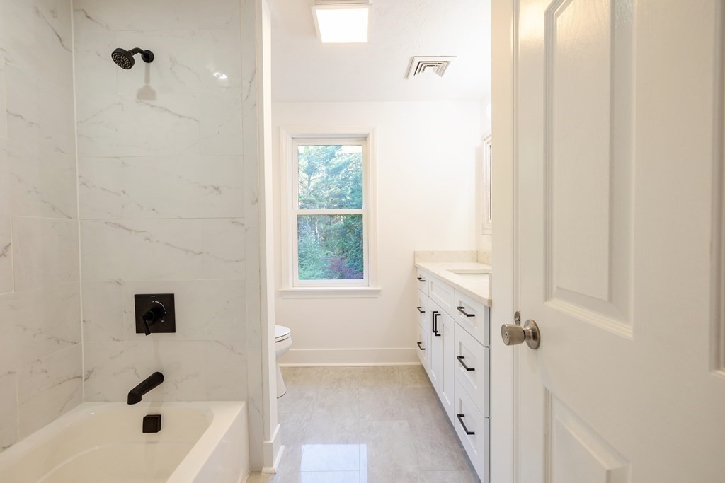 66 Patten Road Westford, MA 01886 - Photo 30 of 42 a bathroom with a bathtub and a shower