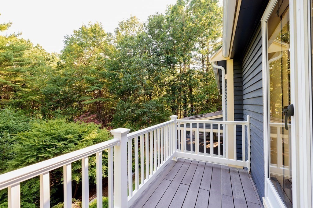 66 Patten Road Westford, MA 01886 - Photo 34 of 42 a view of a wooden balcony and trees