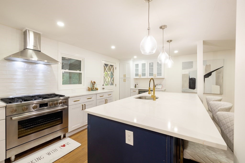 66 Patten Road Westford, MA 01886 - Photo 7 of 42 a kitchen with a stove a sink and a refrigerator