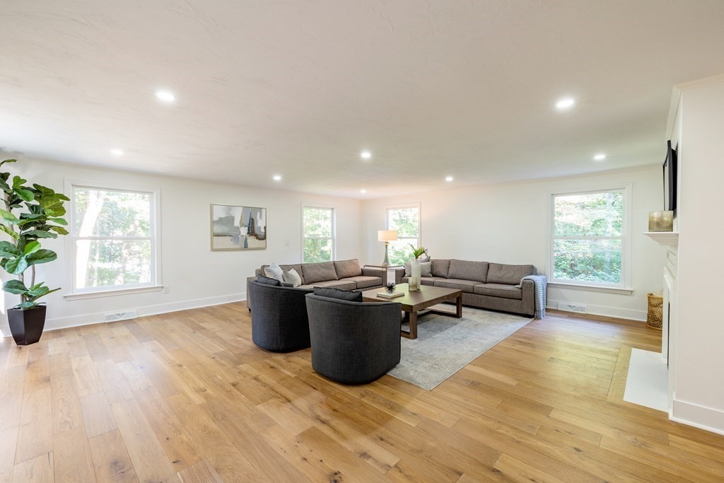 66 Patten Road Westford, MA 01886 - Photo 10 of 42 a living room with furniture and a wooden floor