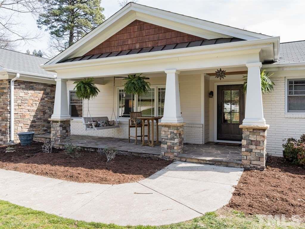 1910 Highland Place Raleigh, NC 27607 - Photo 2 of 25 a front view of a house with garden