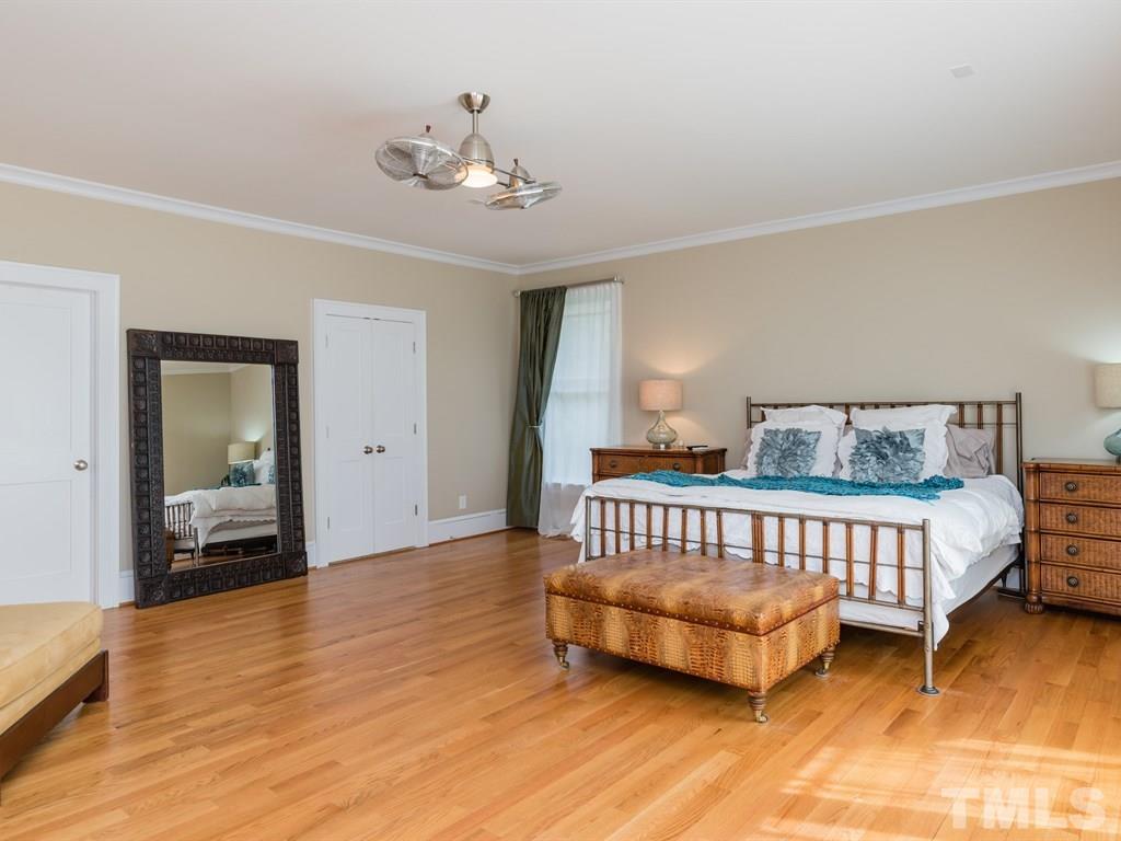 1910 Highland Place Raleigh, NC 27607 - Photo 13 of 25 a bedroom with a bed and window