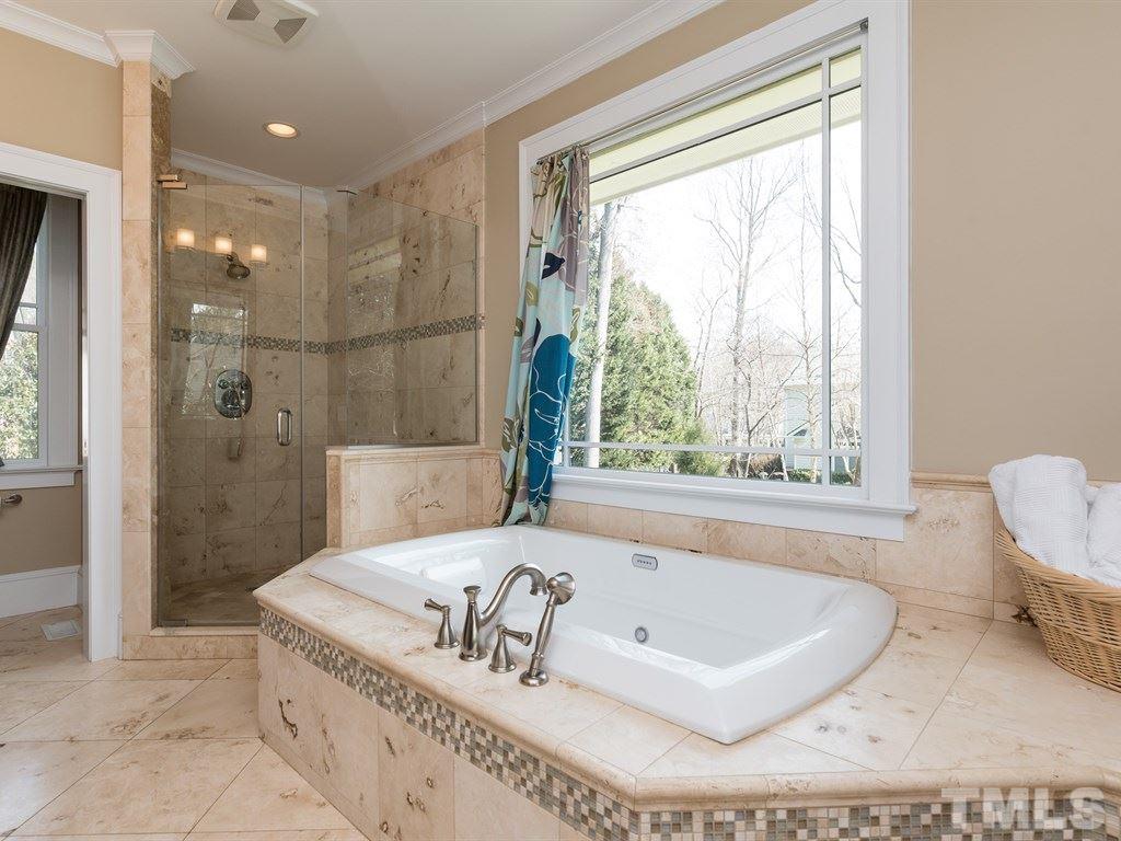 1910 Highland Place Raleigh, NC 27607 - Photo 14 of 25 a spacious bathroom with a tub and a shower