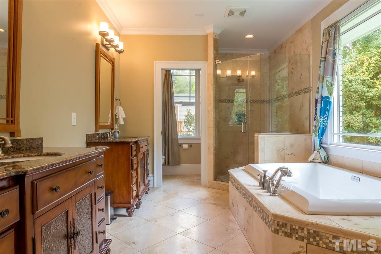 1910 Highland Place Raleigh, NC 27607 - Photo 15 of 25 a spacious bathroom with a tub sink and mirror