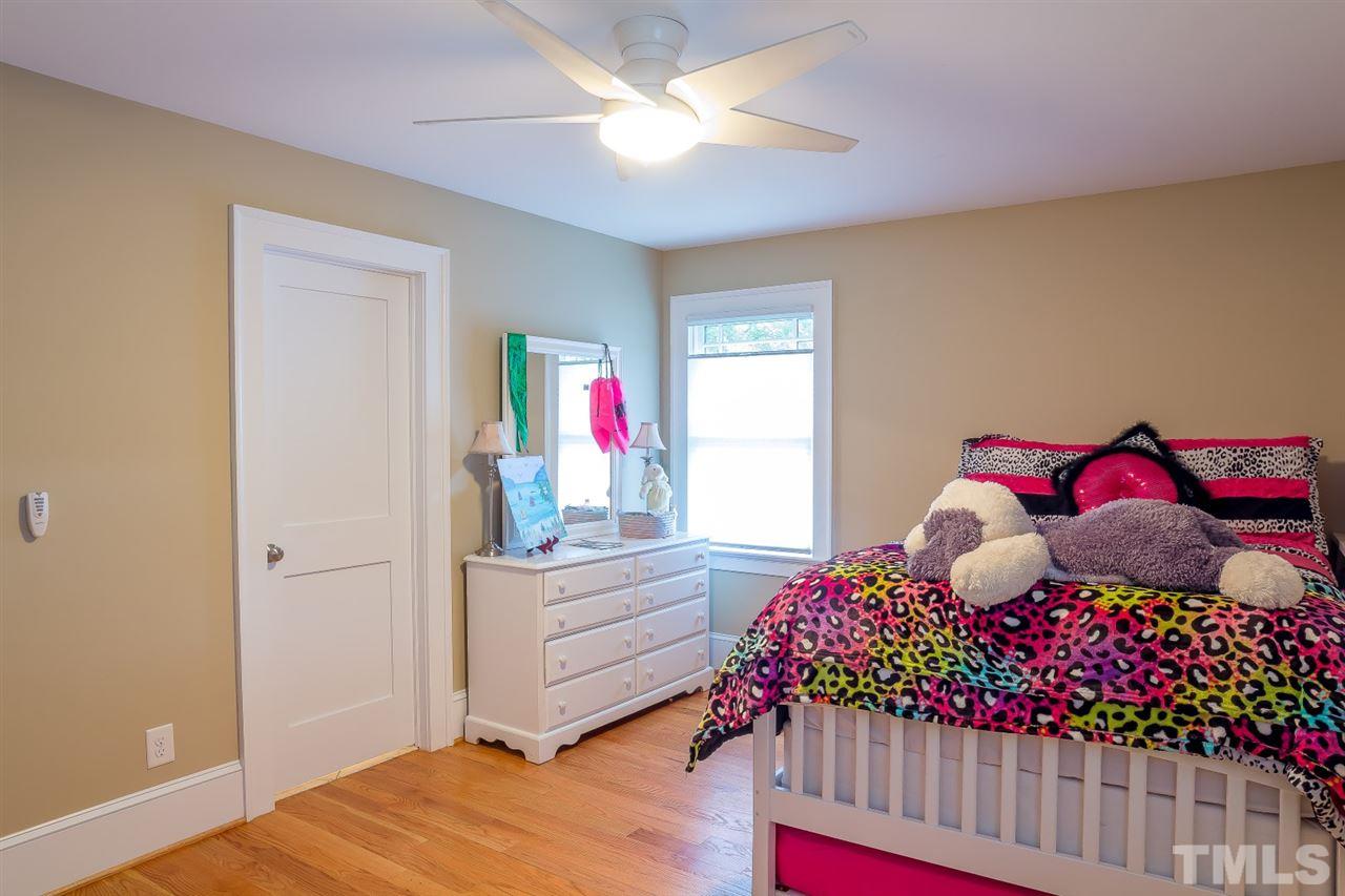 1910 Highland Place Raleigh, NC 27607 - Photo 17 of 25 a bedroom with a bed and a window