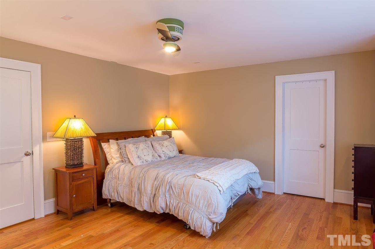 1910 Highland Place Raleigh, NC 27607 - Photo 18 of 25 a bedroom with a bed and a table