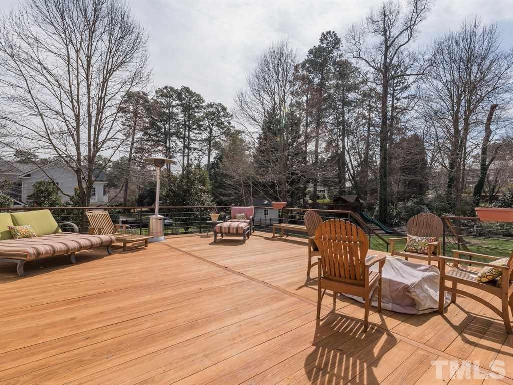 1910 Highland Place Raleigh, NC 27607 - Photo 22 of 25 a view of backyard with seating area and trees