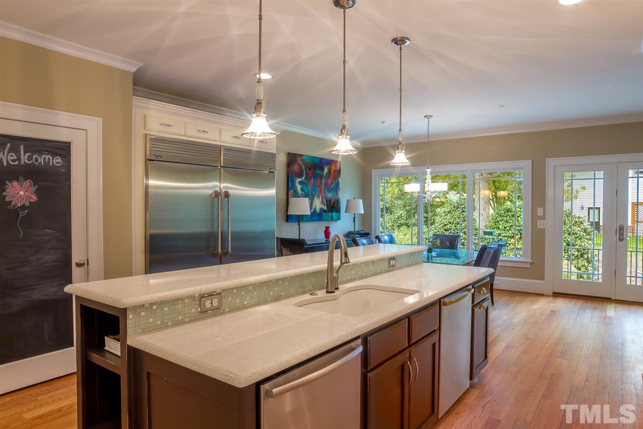 1910 Highland Place Raleigh, NC 27607 - Photo 5 of 25 a kitchen with counter top space and wooden floor