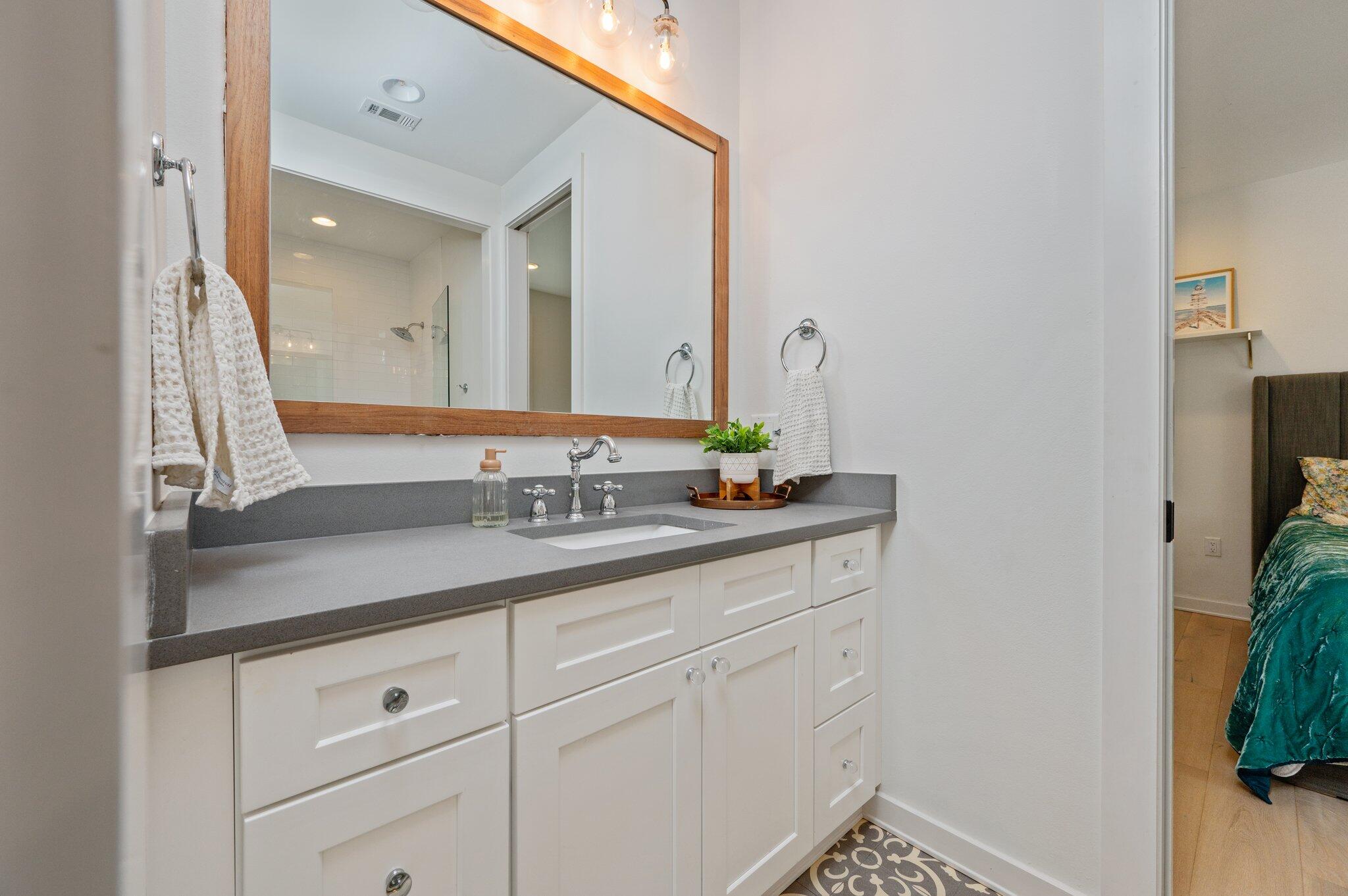 164 Bay Trace Santa Rosa Beach, FL 32459 - Photo 65 of 90 a bathroom with a sink and a mirror
