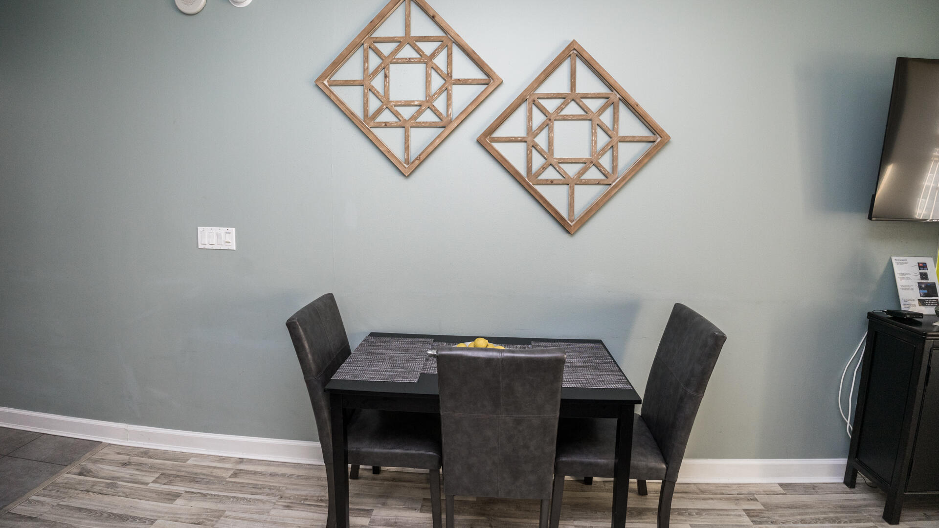 11800 Front Beach Road, Unit 703 Panama City Beach, FL 32407 - Photo 22 of 52 a view of a dining room with furniture and wooden floor