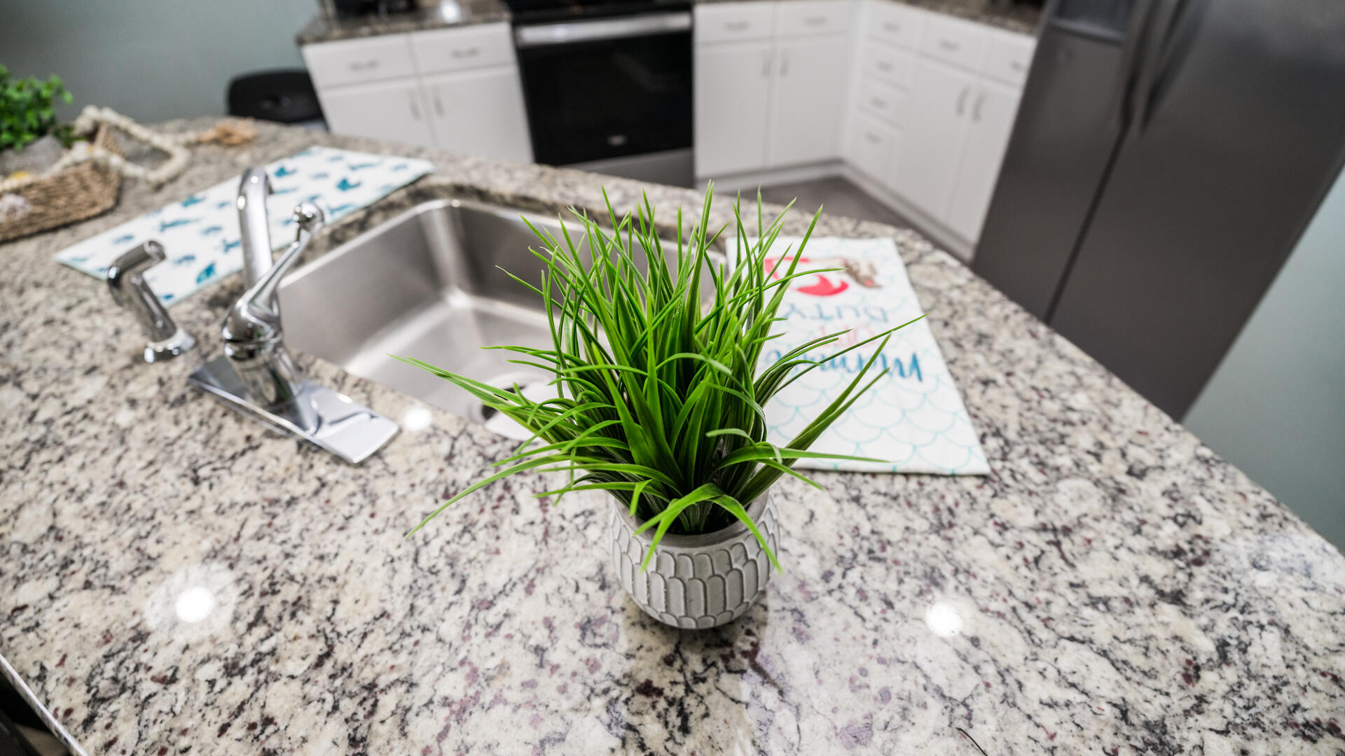 11800 Front Beach Road, Unit 703 Panama City Beach, FL 32407 - Photo 34 of 52 a vase of flowers sitting on a table