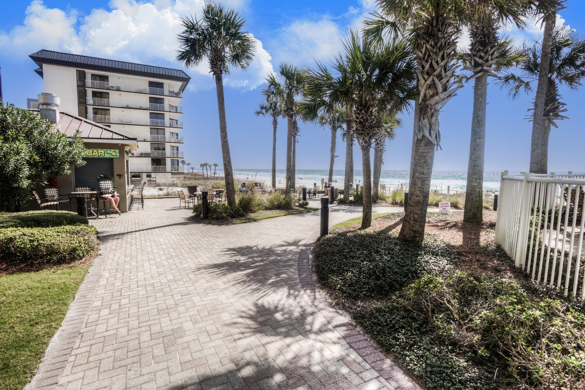 11800 Front Beach Road, Unit 703 Panama City Beach, FL 32407 - Photo 42 of 52 a view of a yard in front of a house