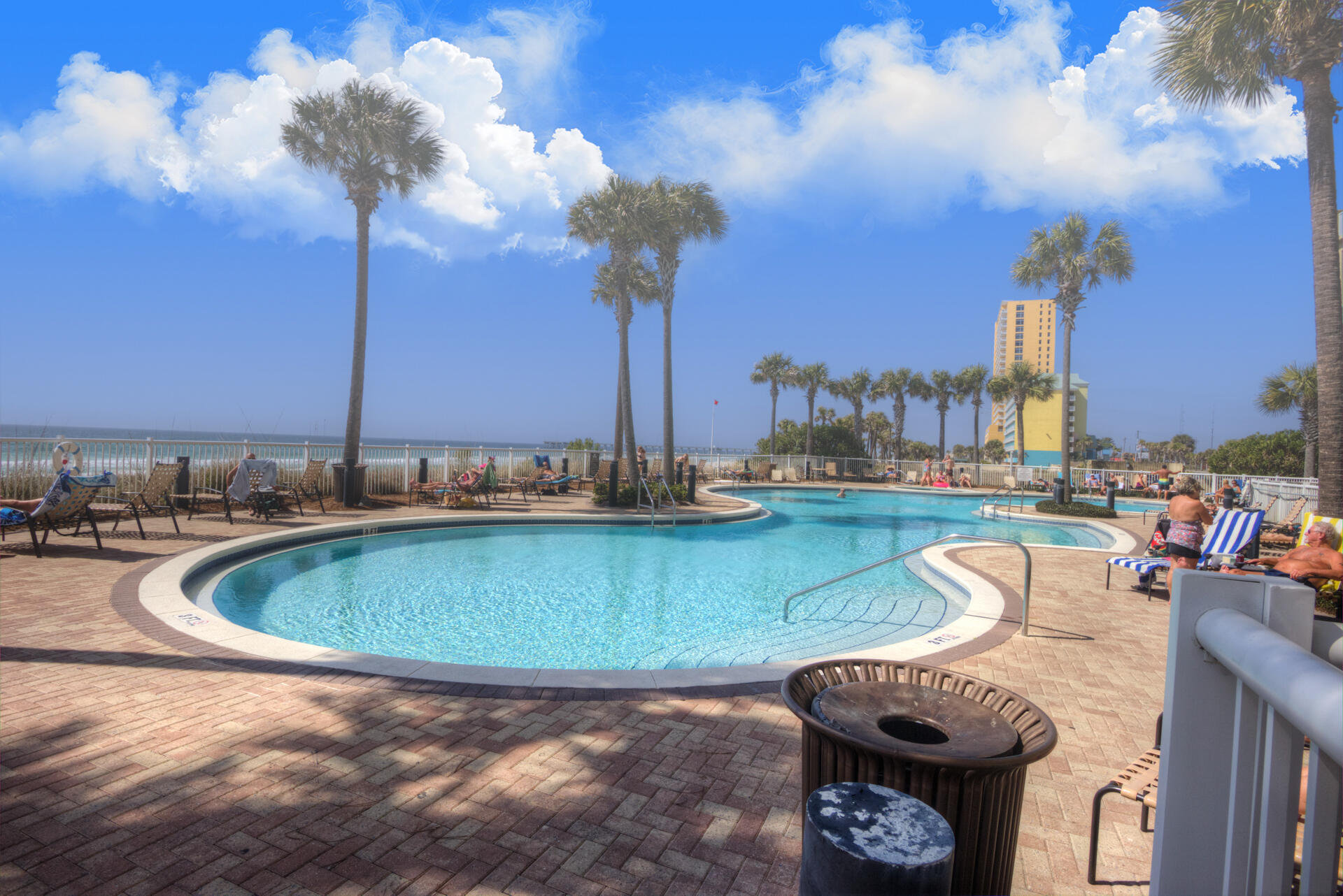 11800 Front Beach Road, Unit 703 Panama City Beach, FL 32407 - Photo 48 of 52 a view of a swimming pool with a patio and a yard