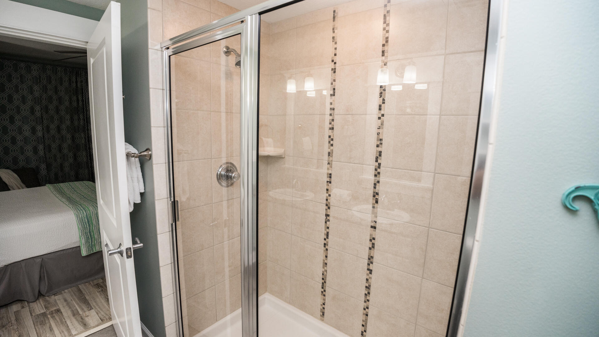 11800 Front Beach Road, Unit 703 Panama City Beach, FL 32407 - Photo 6 of 52 a bathroom with a shower and a glass door