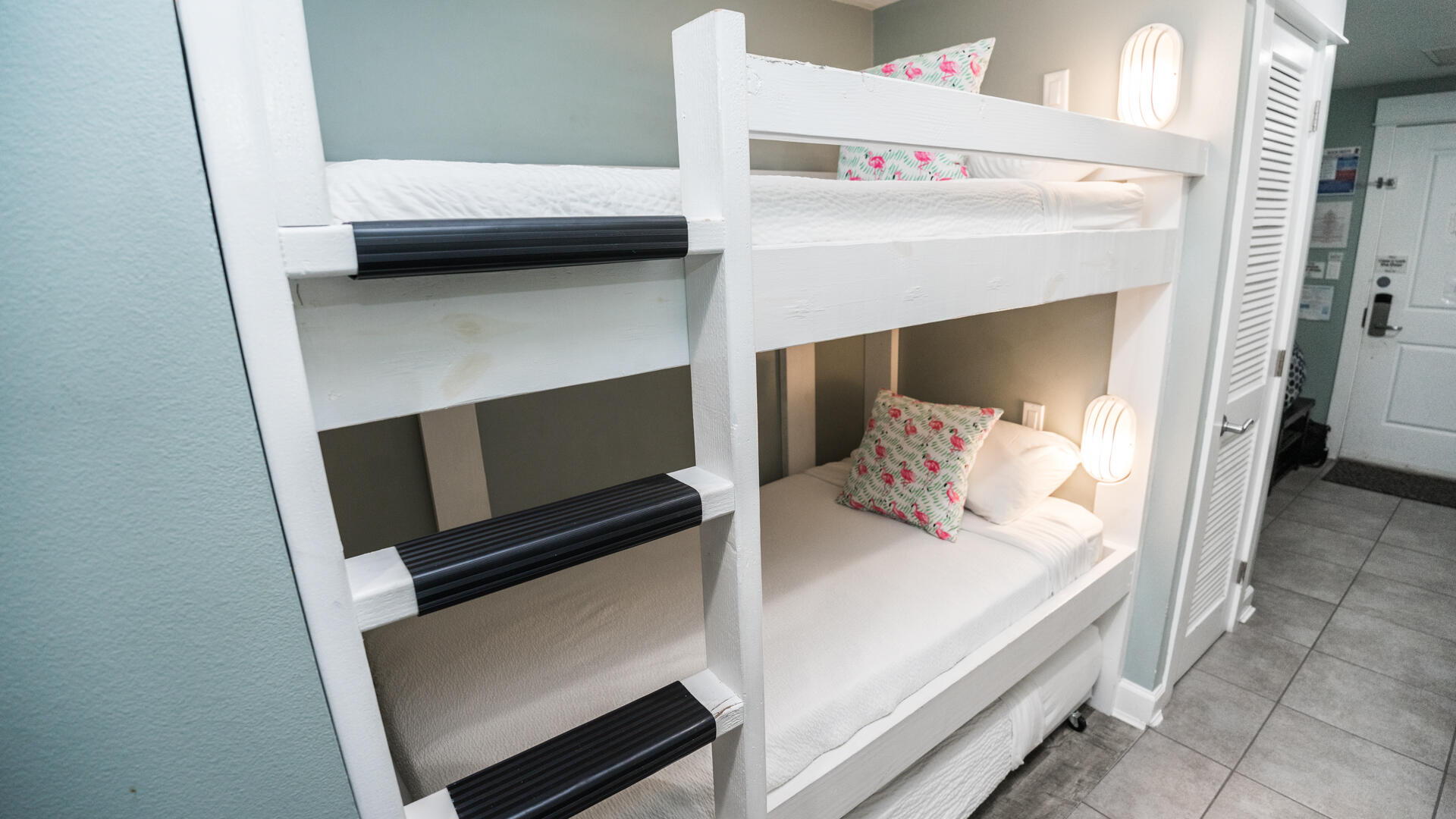 11800 Front Beach Road, Unit 703 Panama City Beach, FL 32407 - Photo 10 of 52 a bedroom with a bed and a night stand