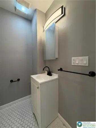 a view of a bathroom with a sink and mirror