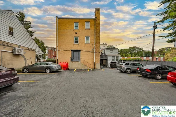 a view of a cars parked in front of a house
