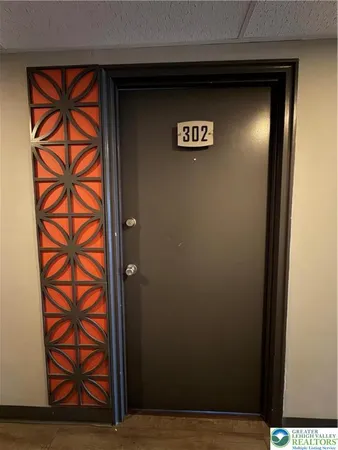 a view of a door and wooden floor