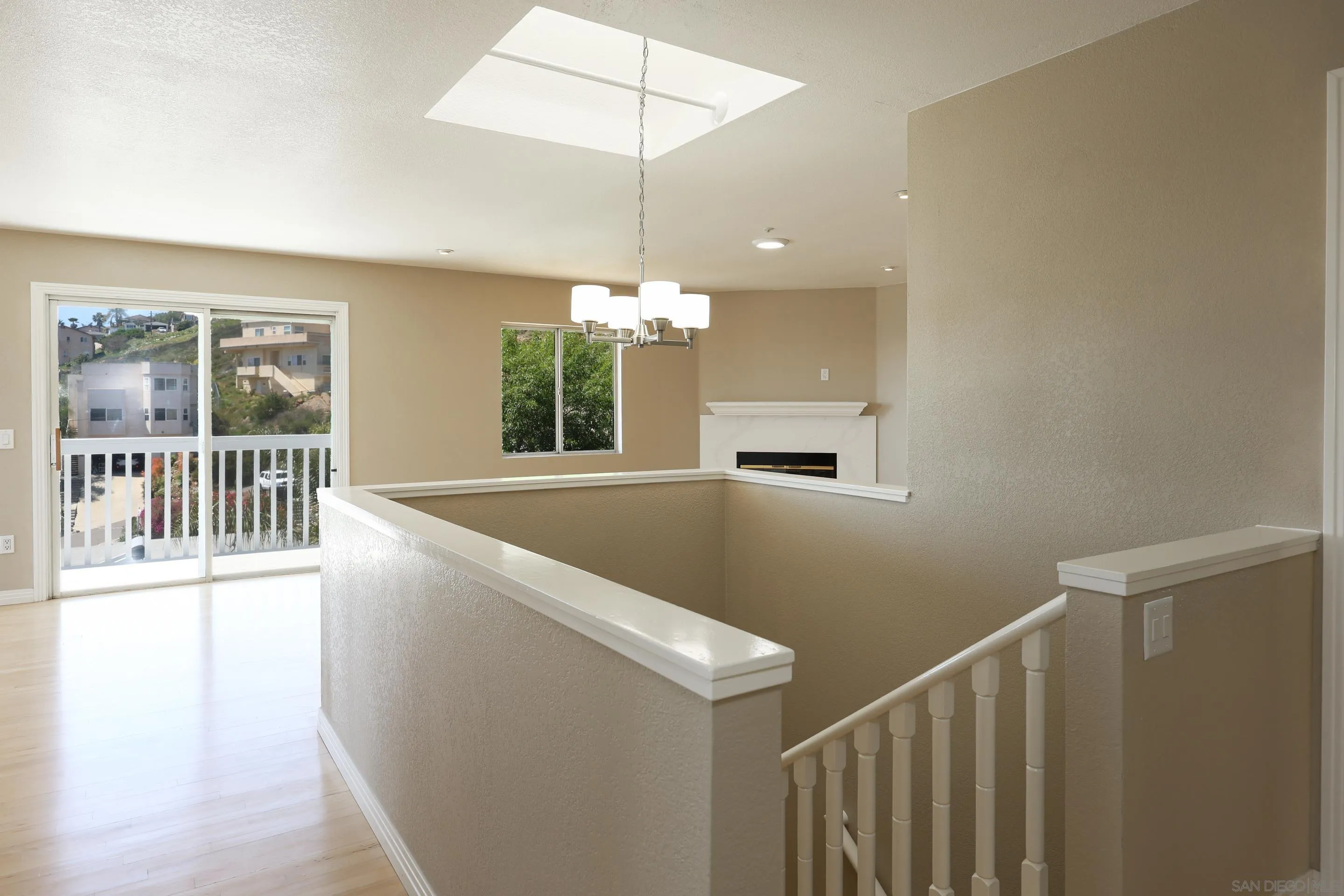 1412 San Miguel Avenue Spring Valley, CA 91977 - Photo 11 of 44 a view of a room with wooden floor a ceiling fan and windows