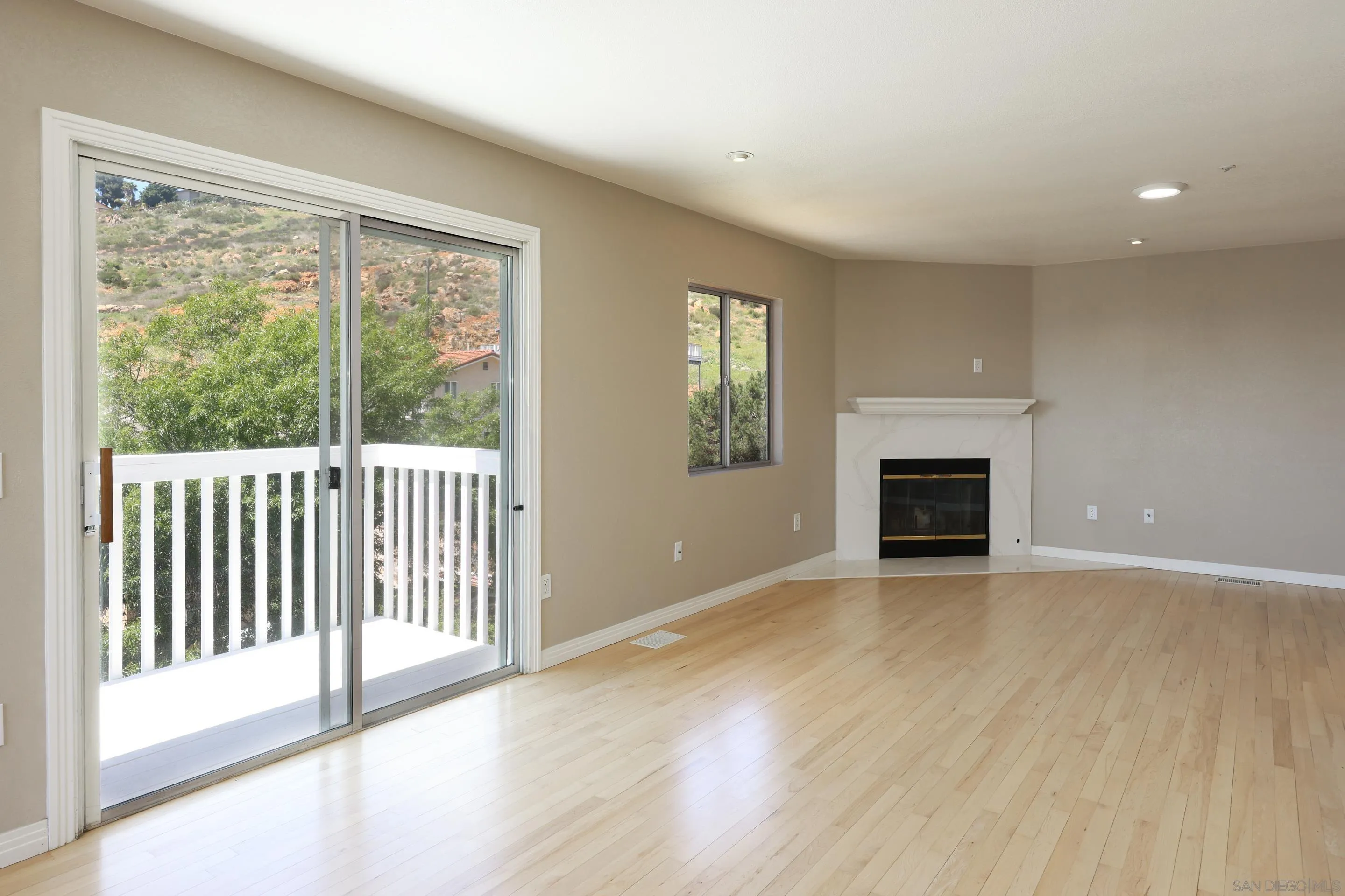 1412 San Miguel Avenue Spring Valley, CA 91977 - Photo 18 of 44 a view of an empty room with wooden floor and a window
