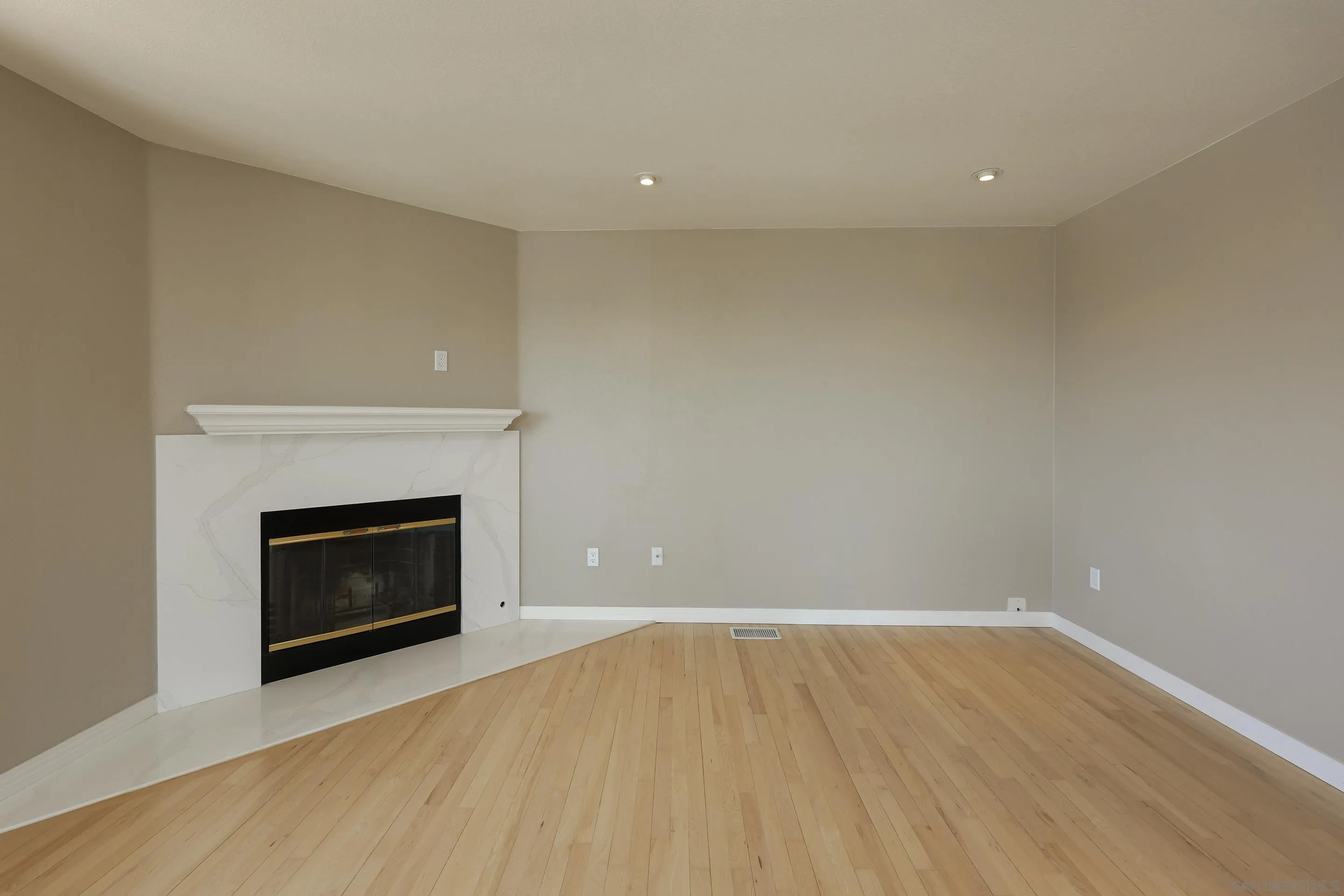 1412 San Miguel Avenue Spring Valley, CA 91977 - Photo 19 of 44 a view of an empty room with wooden floor fireplace and a window