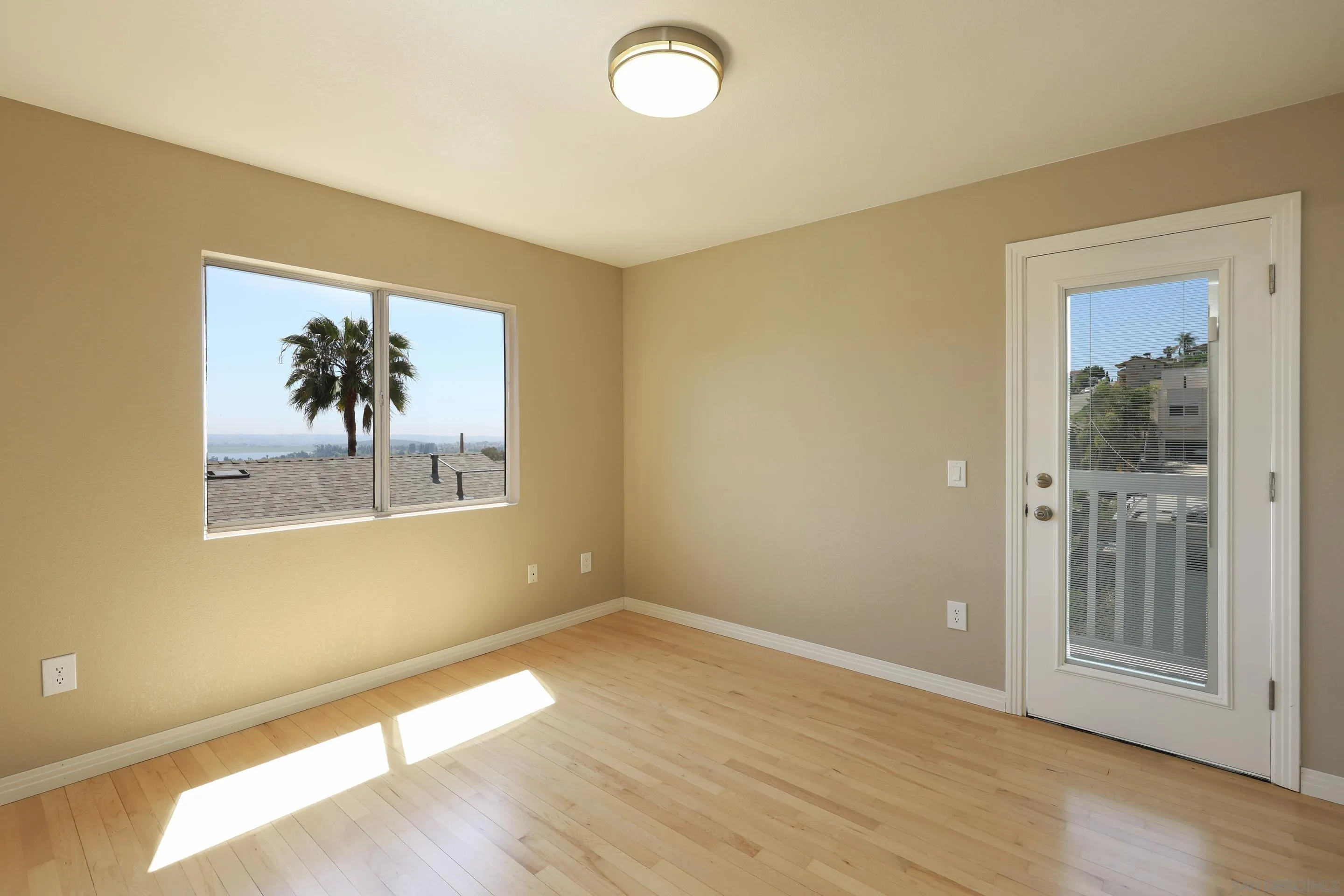 1412 San Miguel Avenue Spring Valley, CA 91977 - Photo 24 of 44 a view of empty room with wooden floor and fan