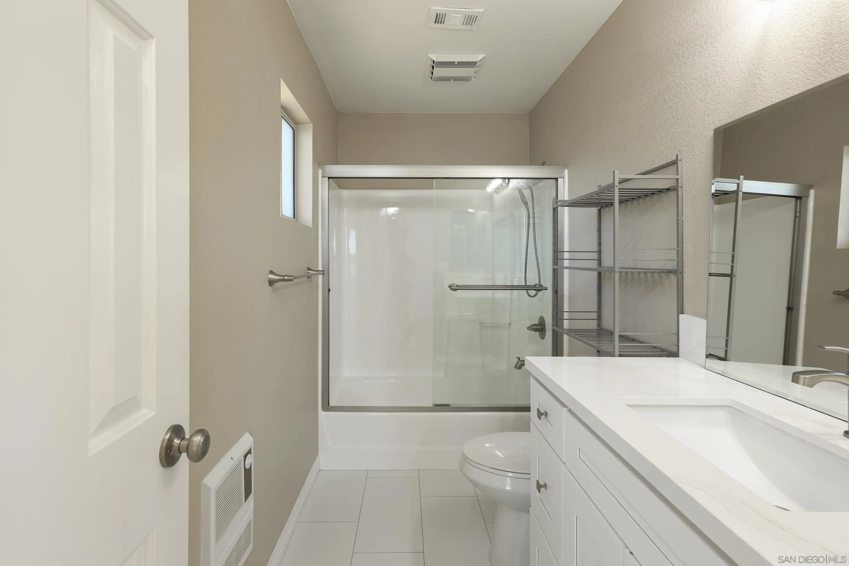 1412 San Miguel Avenue Spring Valley, CA 91977 - Photo 27 of 44 a bathroom with a sink a toilet and shower