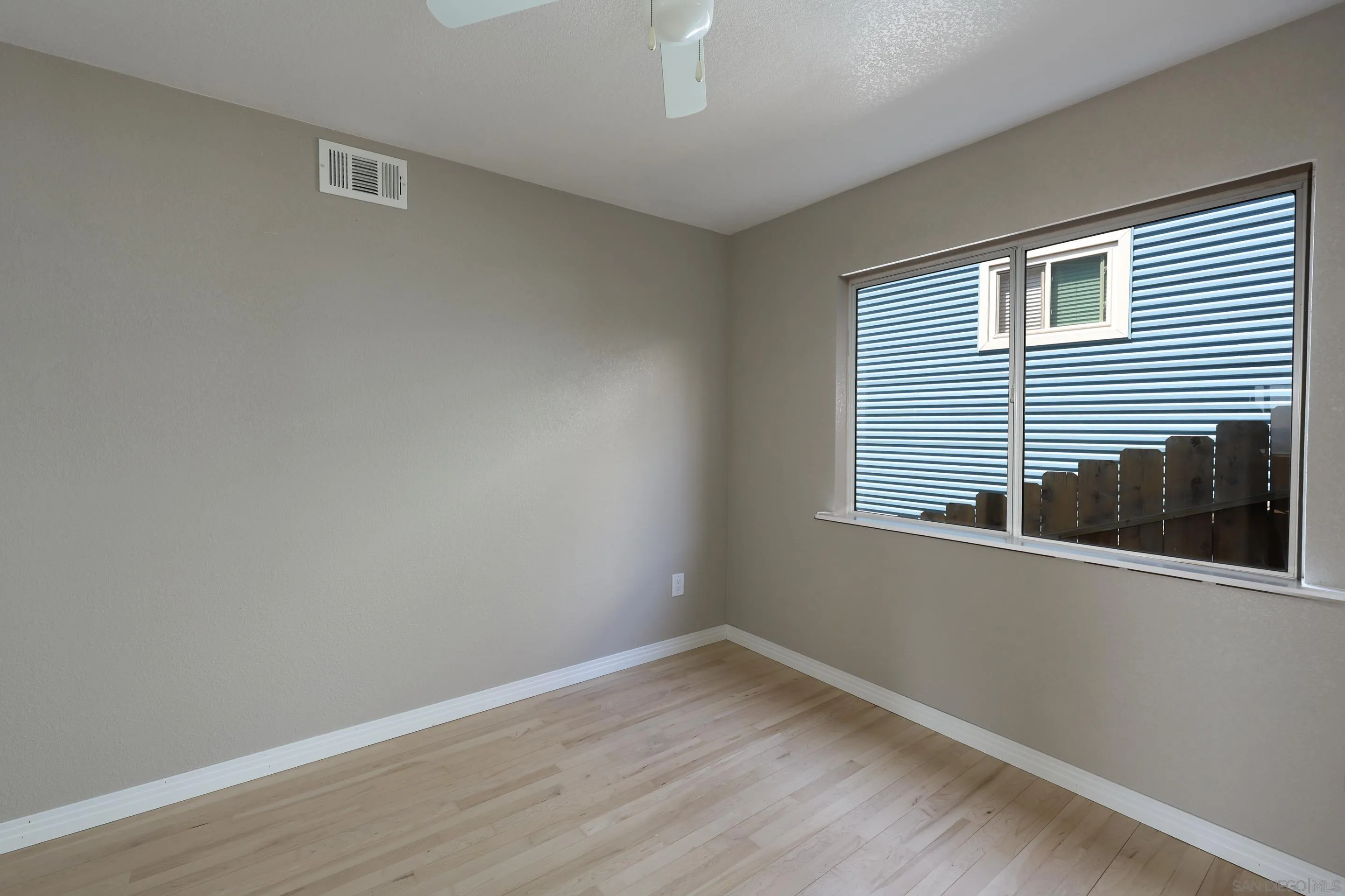 1412 San Miguel Avenue Spring Valley, CA 91977 - Photo 30 of 44 a view of empty room with wooden floor and fan
