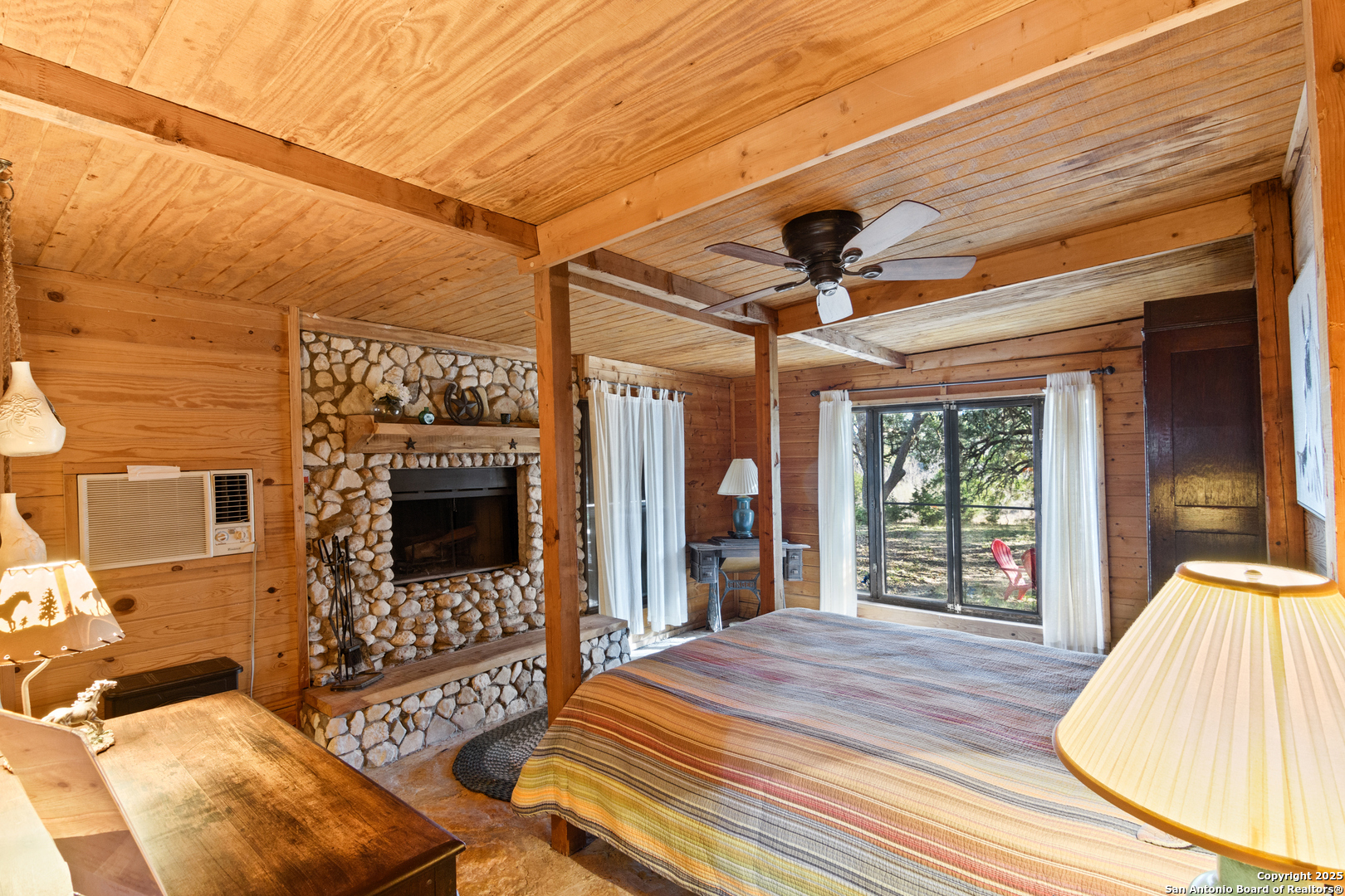 62 Turkey Trot Uvalde, TX 78801 - Photo 11 of 39 a spacious bedroom with a bed and a large window